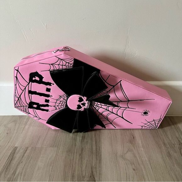 Dolls Kill oversize pink and black skull spiderweb coffin backpack. New in box